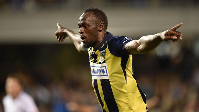 Usain Bolt celebrates scoring one of his goals for the Mariners against Macarthur South West United. Picture: AFP