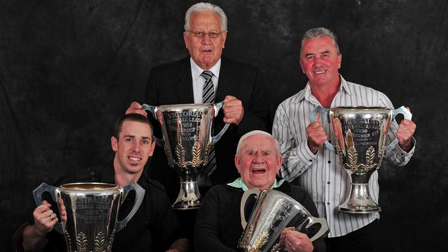 Collingwood captains with premiership cups. Nick Maxwell (2010), Murray Weideman (1958), Lou Richards (1953) and Tony Shaw (1990).