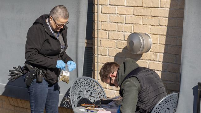 Detectives combing through a home during a search warrant. Picture: NSW Police