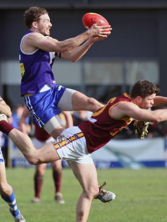 Adam Short climbs high for a mark in his last stint at Sunbury. Picture: Aaron Cook