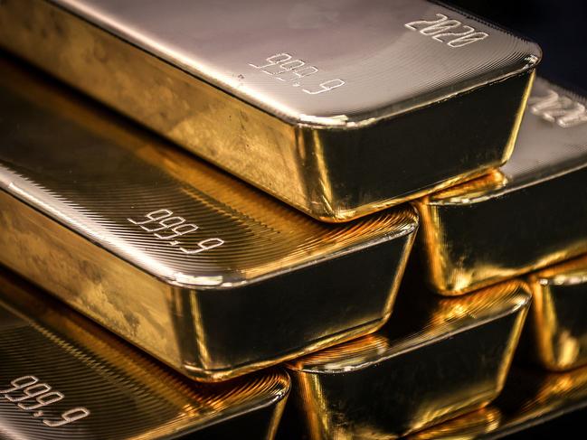 TOPSHOT - Gold bullion bars are pictured after being inspected and polished at the ABC Refinery in Sydney on August 5, 2020. - Gold prices hit 2,000 USD an ounce on markets for the first time on August 4, the latest surge in a commodity seen as a refuge amid economic uncertainty. (Photo by DAVID GRAY / AFP)