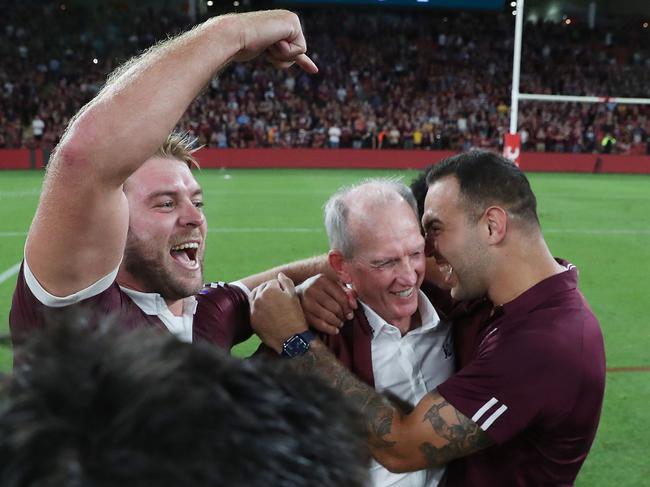 Wayne Bennett is jumped by the Queenslanders. Picture: Peter Wallis