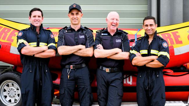 Queensland Fire and Rescue Swiftwater Rescue technicians Hal Tucker and Ron Arends (centre), both station officers at South Townsville Fire Station, flanked by firefighter Anthony Reay and senior firefighter Scott Ayoub. The four-man crew were called into action on their way to Ingham during the severe weather event on Tuesday. Picture: Cameron Bates