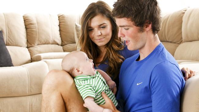 Dylan Roberton with wife Amy and an 11-week-old Boston.