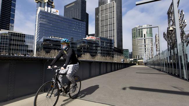 A woman cycling at an empty Southbank on Monday morning. Picture: NCA NewsWire/David Geraghty