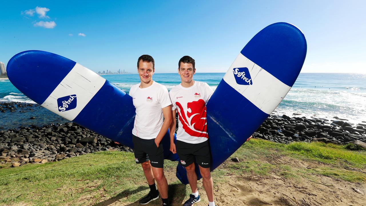 British triathletes Alistair and Jonny Brownlee had a surf lesson at Burleigh Heads before flying overseas after spending six weeks on the Gold Coast. Picture: Nigel Hallett