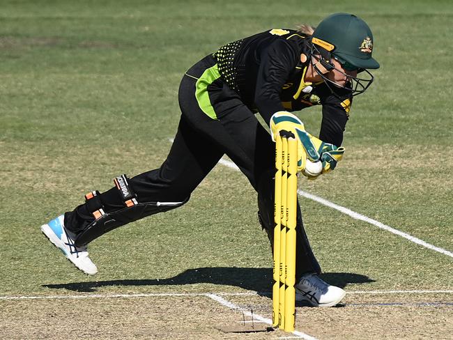 BRISBANE, AUSTRALIA - SEPTEMBER 27: Alyssa Healy of Australia takes a catch to dismiss Lauren Down of New Zealand during game two of the T20 Women's International series between Australia and New Zealand at Allan Border Field on September 27, 2020 in Brisbane, Australia. (Photo by Bradley Kanaris/Getty Images)