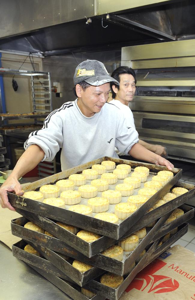 Vu Than Tran, and Le Nguyen, who are bakers at the ''An Phat Bakery'', in Cabramatta, hard at work producing thousands of Moon Cakes, in time for the annual Moon Festival.