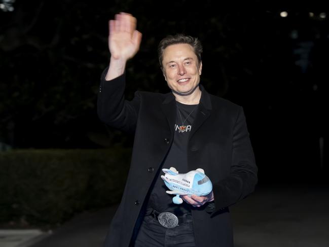 Elon Musk holds a stuffed Air Force One toy after arriving with US President Donald Trump on Marine One at the White House. Picture: AP