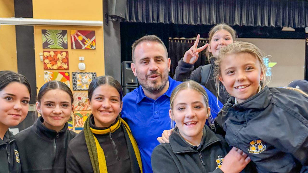 Former NRL player and anti-bullying advocate Josh Reynolds with students in Orange NSW.