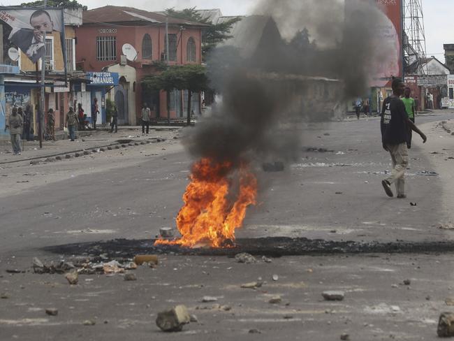 Protesters in Kinshasa burned tyres and set up makeshift barricades that were later cleared by security forces. Picture: AP Photo/John Bompengo
