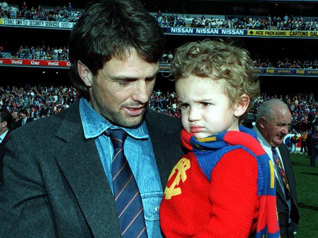 Sydney swans player & former Lion, Paul Roos & son at AFL match Richmond v Fitzroy, it was Lions last game in Victoria as they are merging with Brisbane Bears for 1997 season.  Australian Rules 1996Roos/Fam