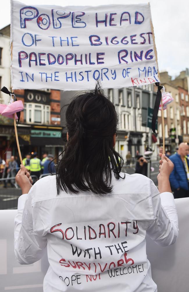 A protester holds up a sign about the sex abuse scandal in the Catholic Church as Pope Francis travels through Dublin in August 2018. Picture: Charles McQuillan/Getty Images