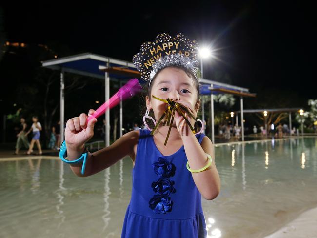 Hope Russell, 6, celebrates New Year's Eve on the Cairns Esplanade. Picture: Brendan Radke