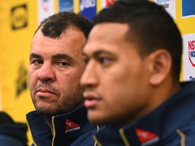 Wallabies coach Michael Cheika, (left), looks on as Israel Folau speaks during a media conference at the Sydney Cricket Ground, in Sydney, Tuesday, Aug. 4, 2015. The Wallabies play the All Blacks in the Rugby Championship decider in Sydney on Saturday. (AAP Image/Dan Himbrechts) NO ARCHIVING