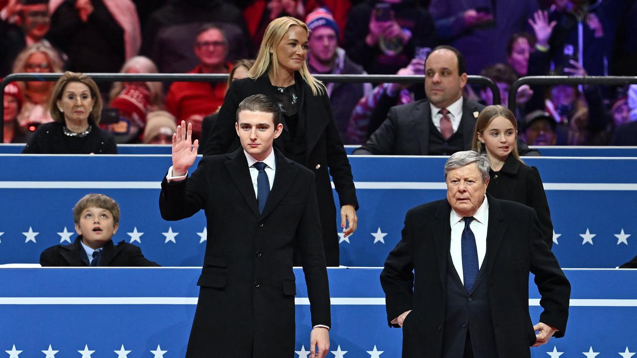 Barron Trump and his grandfather, Viktor Knavs, attend the inaugural parade inside Capital One Arena, in Washington, DC. Picture: AFP