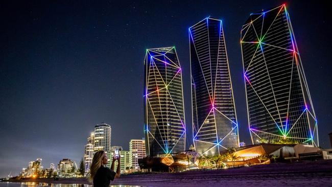 LMPR Group’s Portia Large takes in the Surfers Paradise Jewel towers lit up by Blue Star lighting specialists - in a $3m display project of 6000 individually programmed remote controlled lighting pixels. The shows will regularly light up the Glitter Strip skyline. Picture: Luke Marsden.