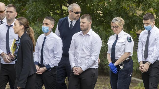 Thomas Nichols, Thomas Pinnington, Jeremy Dale Sandel and Kain Mazomenos, pictured left to right in handcuffs. Picture: NCA NewsWire