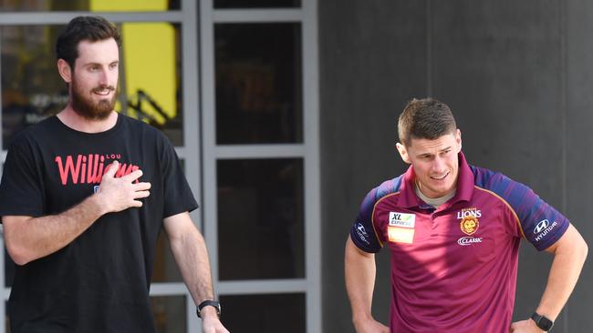 Brisbane players Darcy Gardiner (left) and Dayne Zorko leave the Gabba after they were tested for coronavirus. Picture: AAP