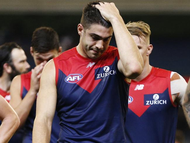 Demons players look dejected after the Round 5 AFL match between the Melbourne Demons and the St Kilda Saints at the MGC in Melbourne, Saturday, April 20, 2019.  (AAP Image/Daniel Pockett) NO ARCHIVING, EDITORIAL USE ONLY