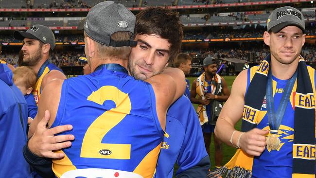 Mark LeCras embraces Andrew Gaff after the Grand Final.