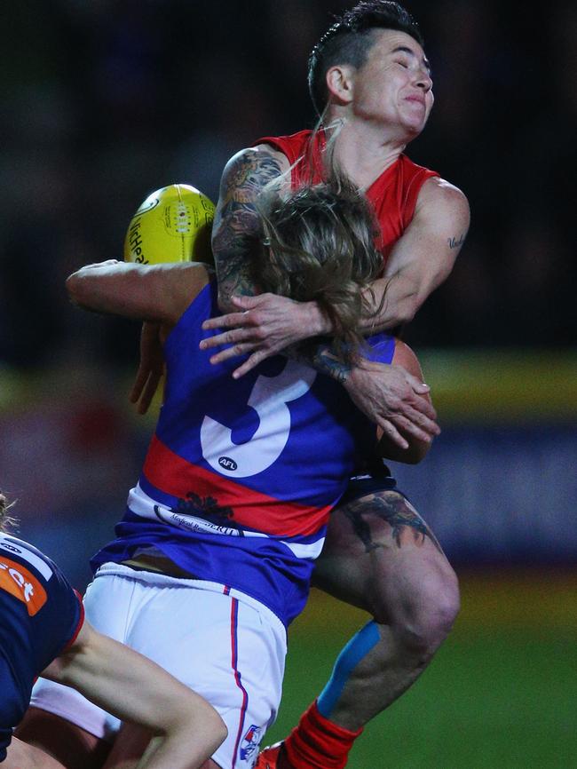 Katie Brennan is tackled by Ceceila MacIntosh.