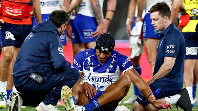 SYDNEY, AUSTRALIA - APRIL 06: Stephen Crichton of the Bulldogs receives attention from trainers during the round five NRL match between Canterbury Bulldogs and Newcastle Knights at Accor Stadium, on April 06, 2025, in Sydney, Australia. (Photo by Brendon Thorne/Getty Images)