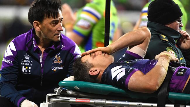 Billy Slater of the Storm is carried off after being knocked out during the Round 20 NRL match between the Canberra Raiders and the Melbourne Storm at GIO Stadium in Canberra, Saturday, July 22, 2017. (AAP Image/Mick Tsikas) NO ARCHIVING, EDITORIAL USE ONLY