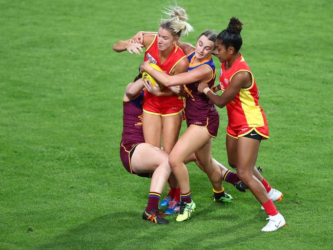 Gold Coast’s Paige Parker is tackled during the AFLW Winter Series match against the Brisbane Lions at Metricon Stadium in July 14. Picture: Chris Hyde/Getty Images