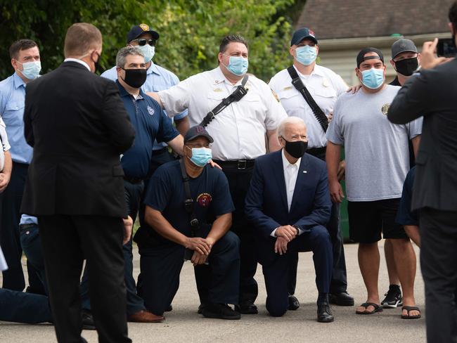 Democratic presidential nominee Joe Biden poses for photos as he makes a stop to deliver pizzas to Pittsburgh Firefighters. Pictures: Saul Loeb/ AFP