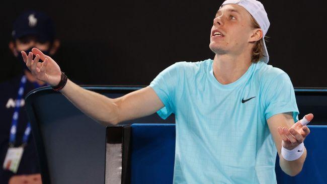 Canada's Denis Shapovalov reacts as he plays against Italy's Jannik Sinner during their men's singles match on day one of the Australian Open tennis tournament in Melbourne on February 8, 2021. (Photo by David Gray / AFP) / -- IMAGE RESTRICTED TO EDITORIAL USE - STRICTLY NO COMMERCIAL USE --