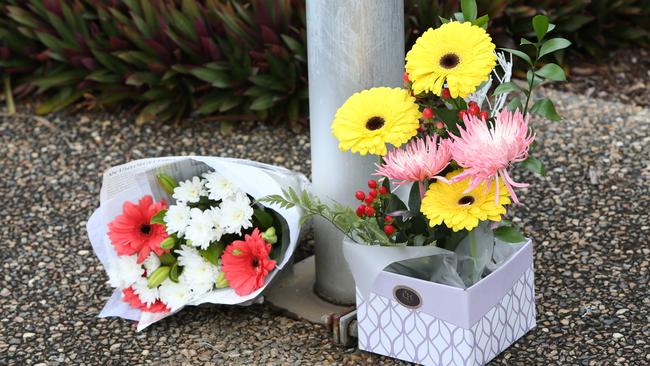 Flowers left in memory of Senior Constable David Masters at the Deception Bay Police StationPhoto Steve Pohlner