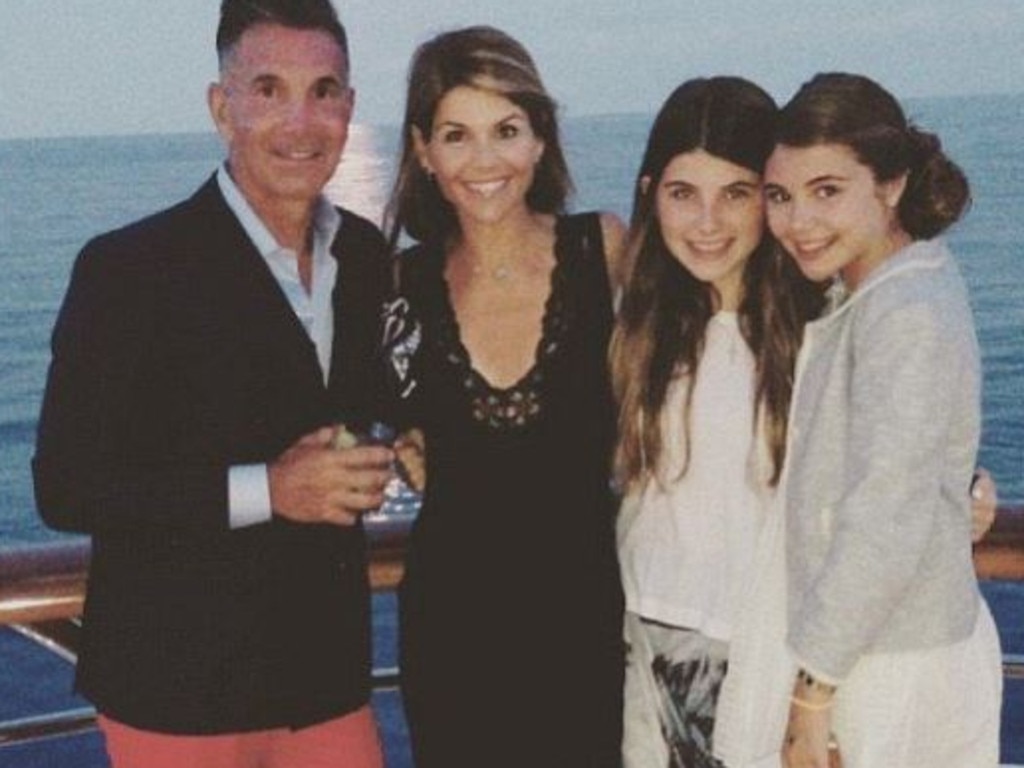 Lori Loughlin, with husband Mossimi Giannulli (left), are facing jail time after they allegedly paid hundreds of thousands of dollars to get their daughter into a top uni. Picture: AP