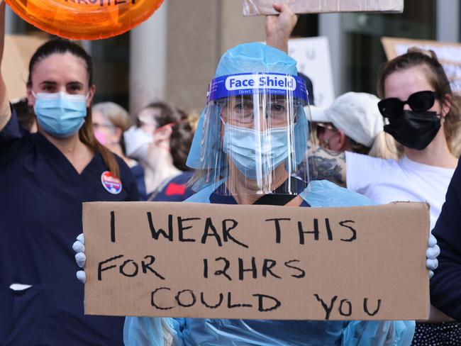 Nurses from across Sydney gathered in front of NSW parliament. Picture: David Swift