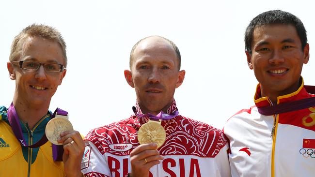 LONDON, ENGLAND - AUGUST 11: (L-R) Silver medalist Jared Tallent of Australia, gold medalist Sergey Kirdyapkin of Russia and bronze medalist Tianfeng Si of China pose during the medal ceremony for the Men's 50km Walk on Day 15 of the London 2012 Olympic Games on The Mall on August 11, 2012 in London, England. (Photo by Streeter Lecka/Getty Images)