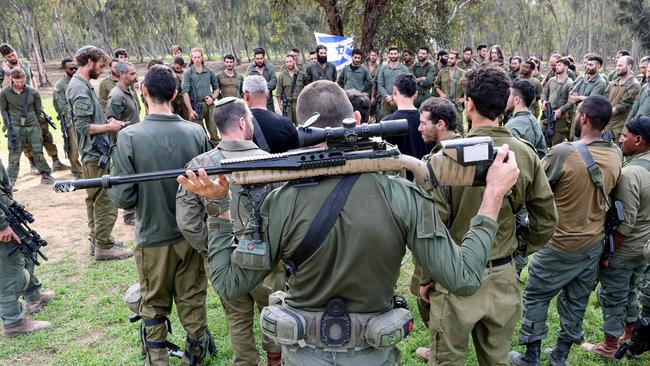 Israeli soldiers gather at the abandoned site of the Supernova music festival after the attack by Hamas militants on October 7. Picture: AFP