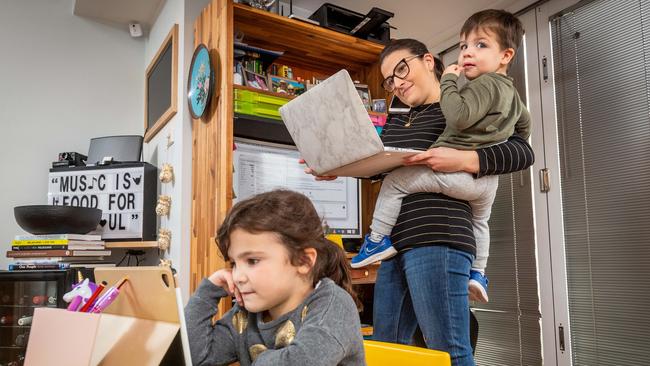 Diana Jeffery juggles a full time job, home schooling her daughter Olivia, 5 and looking after her son Angus, 2, after day car centres were closed due to Lockdown 2.0. Picture: Jake Nowakowski