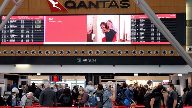 People pictured at the Qantas domestic departures terminal at Sydney Airport ahead of the winter school holidays. Picture: NCA NewsWire / Damian Shaw