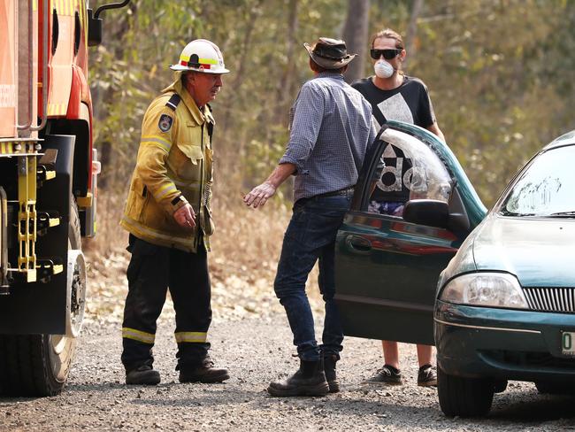 Firefighters battle bushfires in Busbys Flat, northern NSW, Wednesday, October 9, 2019. (AAP Image/Jason O'Brien)