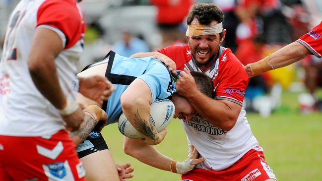 Woolgoolga's Reeyce Sadler is tackled by South Grafton hooker Todd Cameron. Picture: Leigh Jensen