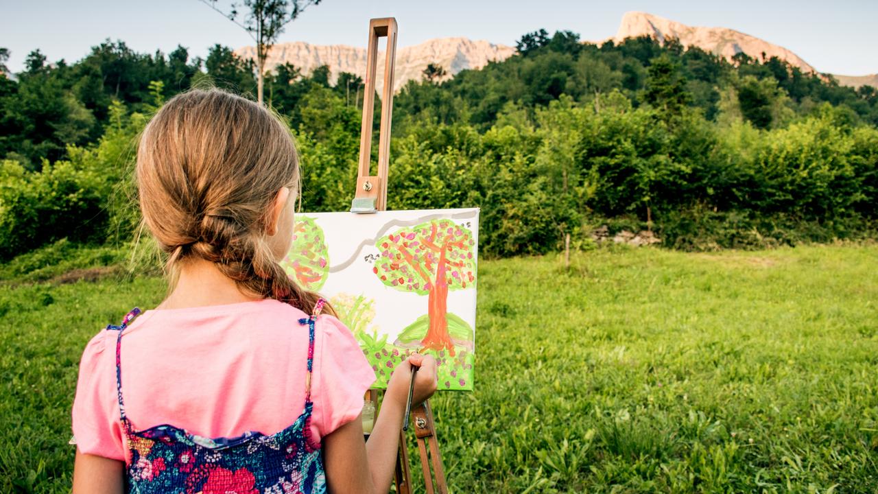 Girl On The Field Painting At Easel The View Of The Mountain - Close Up
