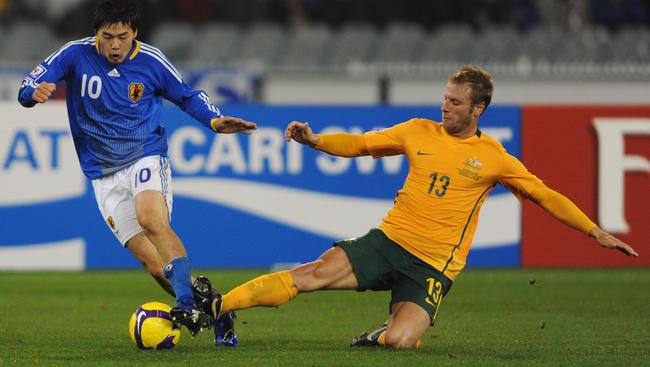 Vince Grella in action for the Socceroos against Japan at the MCG.