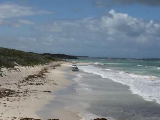 Police are at a beach between Lancelin and Cervantes where the boat of missing fisherman Jeffrey Doyle was located.