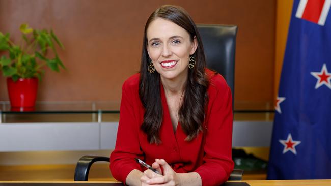 Jacinda Ardern poses at her desk for the last time as Prime Minister. Picture: Getty Images.