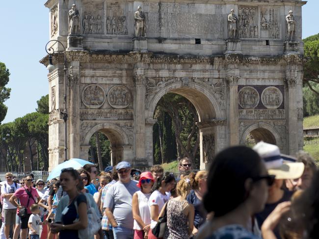 Rome, Italy - July 28, 2015: Visitors wait in the ticket queue for Colosseum during a hot summer day.