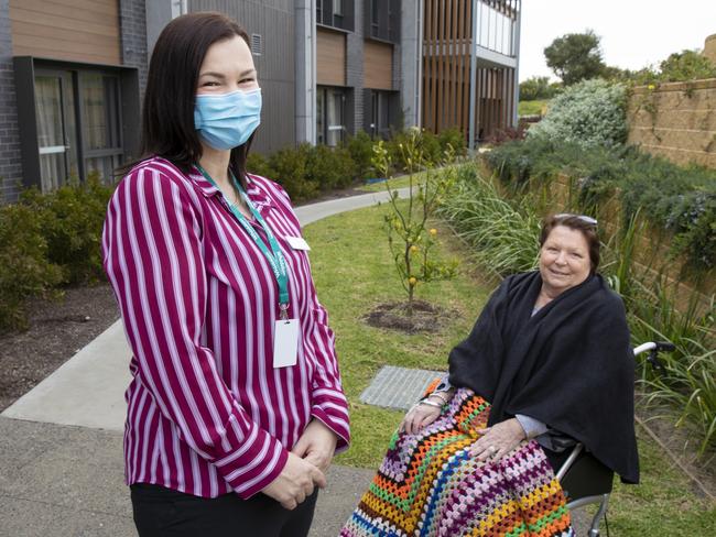 Lauren Smith, who used to be a GP’s assistant doing mainly admin work before switching to a clinical care co-ordinator role, with client Bev Wright. Picture: Peter Stoop