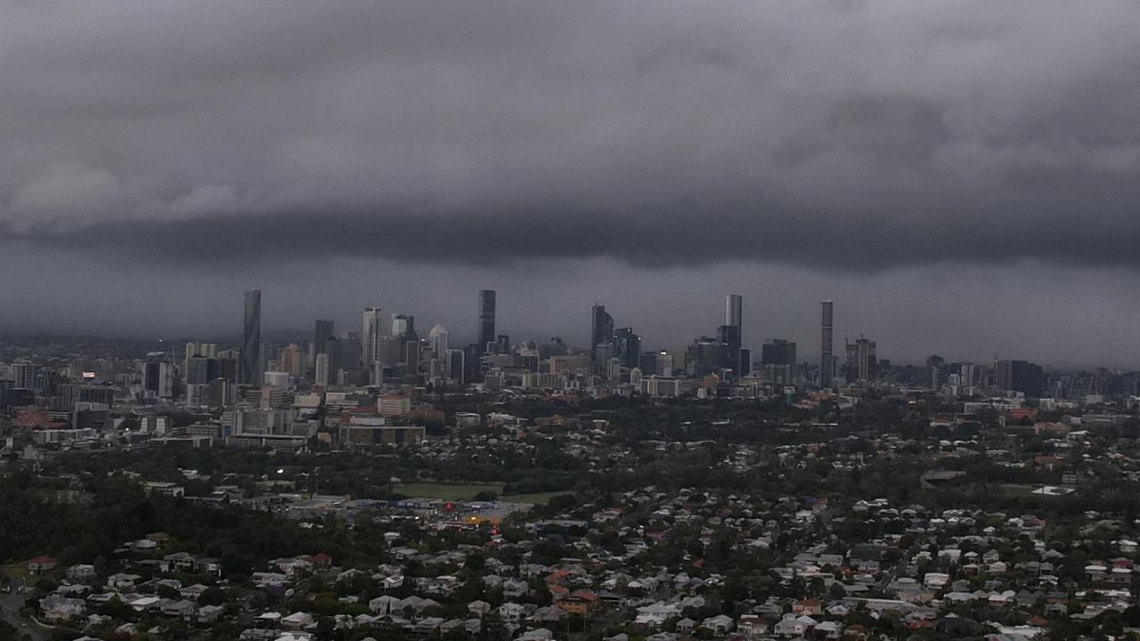 Woolies roof caves in, roads turn to ‘snow’ as massive storm front smashes Brisbane