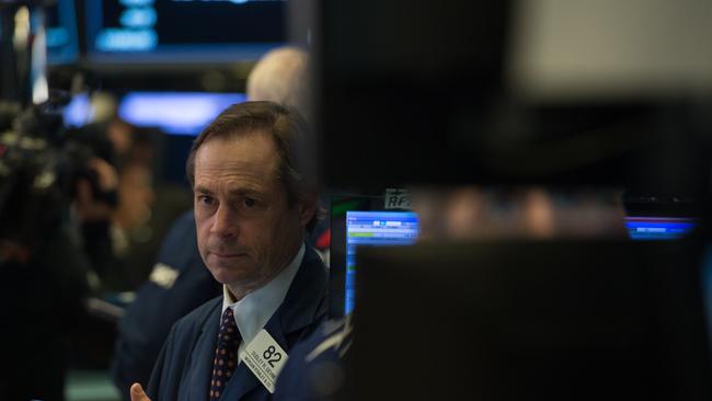 A trader works on the floor at the New York Stock Exchange. (AFP PHOTO/Bryan R. Smith)