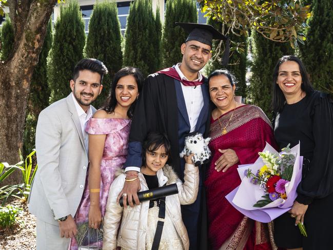 Master of Engineering Science graduate Vikram Beniwal with family (from left) Sid Saharan, Shweta Beniwal, Elina Grewal, Kamla Beniwal and Sonia Grewal at a UniSQ graduation ceremony at Empire Theatres, Wednesday, June 28, 2023. Picture: Kevin Farmer