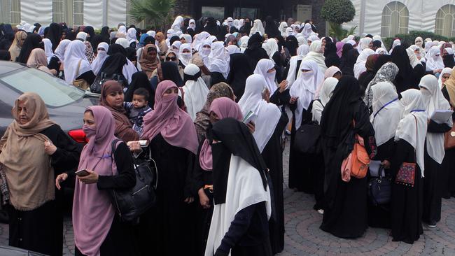 Students and teachers of Al-Huda International Seminary leave after attending a lecture from their seminary founder Farhat Hashmi in Lahore, Pakistan Tuesday, Dec. 8, 2015. In a statement on the website of Farhat Hashmi, fonder of Al-Huda International seminary, whose former student helped carry out the California mass shooting, says the group is non-political and has no links to extremists. (AP Photo/K.M. Chaudary)